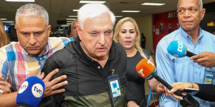 Former Panamanian President Ricardo Martinelli is seen before the arrival of his two sons, Luis Enrique Martinelli and Ricardo Martinelli Jr., at the Tocumen International Airport in Panama City on January 25, 2023. - The two sons of former Panamanian President Ricardo Martinelli, released this Wednesday after serving a sentence in the United States for receiving bribes from the Brazilian construction company Odebrecht, will be released upon return to Panama, their lawyer said. (Photo by Gabriel Rodriguez / AFP)