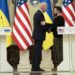 US President Joe Biden (L) speaks with Ukrainian President Volodymyr Zelensky (R) as they attend a joint press conference in Kyiv, on February 20, 2023. - US President Joe Biden made a surprise trip to Kyiv on February 20, 2023, ahead of the first anniversary of Russia's invasion of Ukraine, AFP journalists saw. Biden met Ukrainian President Volodymyr Zelensky in the Ukrainian capital on his first visit to the country since the start of the conflict. (Photo by Evan Vucci / POOL / AFP)