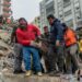 Rescuers carry a body found in the rubble in Adana on February 6, 2023, after a 7.8-magnitude earthquake struck the country's south-east. - The combined death toll has risen to over 1,900 for Turkey and Syria after the region's strongest quake in nearly a century on February 6, 2023. Turkey's emergency services said at least 1,121 people died in the 7.8-magnitude earthquake, with another 783 confirmed fatalities in Syria, putting that toll at 1,904. (Photo by Can EROK / AFP)