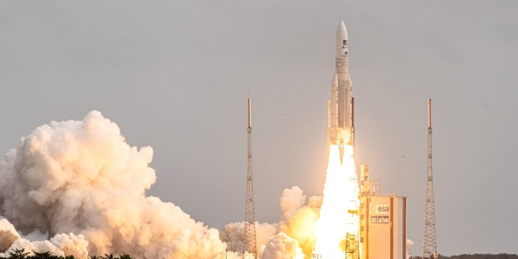 This photograph taken on April 14, 2023, shows Arianespace's Ariane 5 rocket lifting off from its launchpad, at the Guiana Space Center in Kourou, French Guiana. - The European Space Agency's JUICE mission to explore Jupiter's icy, ocean-bearing moons will again try to blast off on April 14, 2023, a day after the first launch attempt was called off due to the threat of lightning. (Photo by Jody AMIET / AFP)