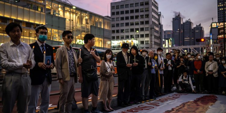 Pro-democracy activists take part in a vigil to mark the 34th anniversary of Beijing Tiananmen crackdown in 1989, in Shinjuku district of Tokyo on June 4, 2023. (Photo by Philip FONG / AFP)