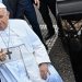 Pope Francis gestures as he prepares to enter his car, leaving after being discharged from the Gemelli hospital in Rome on June 16, 2023, where he underwent abdominal surgery last week. (Photo by Alberto PIZZOLI / AFP)