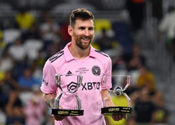 Inter Miami's Argentine forward #10 Lionel Messi poses with the awards for Best Player and Top Scorer after Inter Milan won the Leagues Cup final football match against Nashville SC at Geodis Park in Nashville, Tennessee, on August 19, 2023. (Photo by CHANDAN KHANNA / AFP)