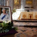 Flowers placed by Britain's Prince William, Prince of Wales and Britain's Catherine, Princess of Wales are pictured next to a portrait of the late Queen Elizabeth inside St David's Cathedral in south-west Wales on September 8, 2023, as they commemorate the life of Her Late Majesty Queen Elizabeth II on the first anniversary of her passing. (Photo by TOBY MELVILLE / POOL / AFP)