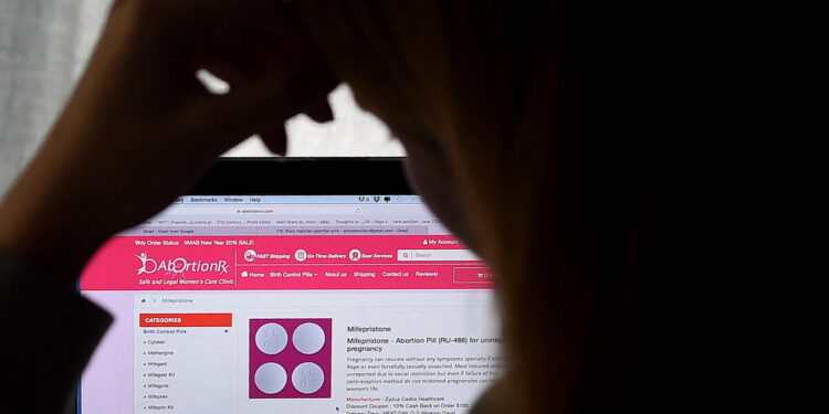 (FILES) In this photo illustration, a person looks at an Abortion Pill (RU-486) for unintended pregnancy from Mifepristone displayed on a computer on May 8, 2020, in Arlington, Virginia. - The manufacturer of a widely used abortion pill asked the US Supreme Court on September 8 to toss out a lower court ruling that would restrict access to the drug.
A US federal appeals court imposed restrictions last month on mifepristone but the ruling was put on hold pending an appeal to the Supreme Court. (Photo by Olivier DOULIERY / AFP) / NO USE AFTER OCTOBER 8, 2023 21:15:34 GMT - RESTRICTED TO EDITORIAL USE - RESTRICTED TO EDITORIAL USE