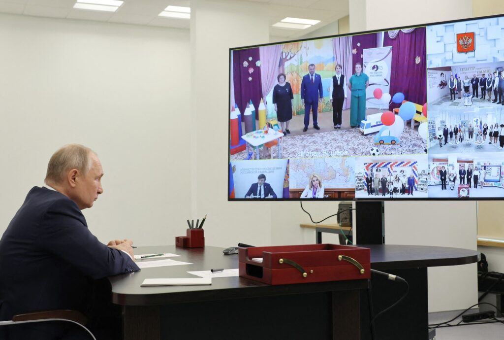 In this pool photograph distributed by Sputnik agency Russian President Vladimir Putin attends an opening ceremony of new educational institutions in five regions of the country, via a video link in Solnechnogorsk in the Moscow region on September 1, 2023. (Photo by Mikhail KLIMENTYEV / POOL / AFP)