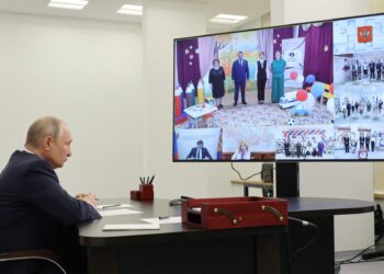In this pool photograph distributed by Sputnik agency Russian President Vladimir Putin attends an opening ceremony of new educational institutions in five regions of the country, via a video link in Solnechnogorsk in the Moscow region on September 1, 2023. (Photo by Mikhail KLIMENTYEV / POOL / AFP)