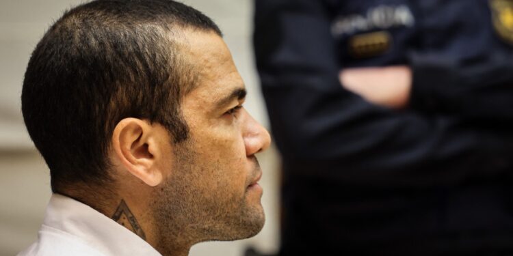 (FILES) Brazilian footballer Dani Alves looks on at the start of his trial at the High Court of Justice of Catalonia in Barcelona, on February 5, 2024. - Ex-Brazil star Dani Alves has been sentenced to 4.5 years in jail for rape, Barcelona's court announced on February 22, 2024. (Photo by Jordi BORRAS / POOL / AFP)