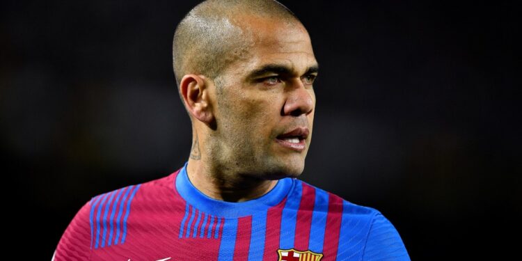 (FILES) Barcelona's Brazilian defender Dani Alves looks on during the Spanish league football match between FC Barcelona and Athletic Club Bilbao at the Camp Nou stadium in Barcelona on February 27, 2022. - Ex-Brazil star Dani Alves has been sentenced to 4.5 years in jail for rape, Barcelona's court announced on February 22, 2024. (Photo by Pau BARRENA / AFP)