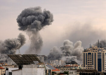 A plume of smoke rises in the sky of Gaza City during an Israeli airstrike on October 9, 2023. - Israel relentlessly pounded the Gaza Strip overnight and into October 9 as fighting with Hamas continued around the Gaza Strip, as the death toll from the war against the Palestinian militants surged above 1,100. (Photo by MAHMUD HAMS / AFP)