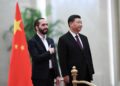 China's President Xi Jinping (R) and El Salvador's President Nayib Bukele (L) stand before they inspect an honour guard during a welcoming ceremony at the Great Hall of the People in Beijing on December 3, 2019. (Photo by Noel Celis / AFP)