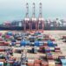An aerial view shows shipping containers stacked at a port in Lianyungang, in eastern China's Jiangsu province on April 12, 2024. - Chinese exports plunged more than expected in March, official figures showed on April 12, as the world's second-largest economy struggles to sustain its post-pandemic recovery. (Photo by AFP) / China OUT / CHINA OUT