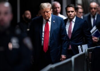 Former US President Donald Trump arrives for the first day of his trial for allegedly covering up hush money payments linked to extramarital affairs, at Manhattan Criminal Court in New York City on April 15, 2024. - Donald Trump is in court Monday as the first US ex-president ever to be criminally prosecuted, a seismic moment for the United States as the presumptive Republican nominee campaigns to re-take the White House. The scandal-plagued 77-year-old is accused of falsifying business records in a scheme to cover up an alleged sexual encounter with adult film actress Stormy Daniels to shield his 2016 election campaign from adverse publicity. (Photo by Jabin Botsford / POOL / AFP)