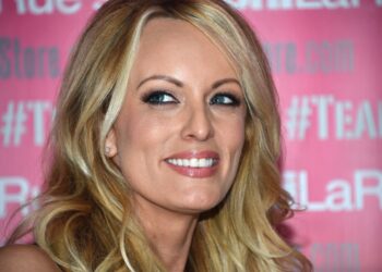(FILES) Adult film star Stormy Daniels poses and signs autographs at Chi Chi Larue's adult entertainment store May 23, 2018 in West Hollywood, California. - Donald Trump goes on trial on April 15, 2024 for allegedly covering up hush money payments to hide affairs ahead of the 2016 presidential election which propelled him into the White House. (Photo by Robyn Beck / AFP)
