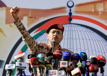 Brigadier Yahya Saree Qasim, spokesman for Yemen's Huthi group, speaks during a rally in solidarity with Palestinians, in the Huthi-controlled Sanaa on May 3, 2024 amid the ongoing conflict in the Gaza Strip between Israel and the Hamas movement. (Photo by MOHAMMED HUWAIS / AFP)
