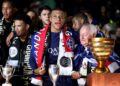 Paris Saint-Germain's French forward #07 Kylian Mbappe (C) celebrates with the French Ligue 1 championship's trophy during a ceremony following the French L1 football match between Paris Saint-Germain (PSG) and Toulouse (TFC) on May 12, 2024 at the Parc des Princes stadium in Paris. (Photo by FRANCK FIFE / AFP)